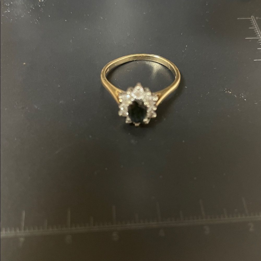 Vtg 14K P Gold Ring with Dk Blue Sapphire surrounded by 12 brilliant diamonds.